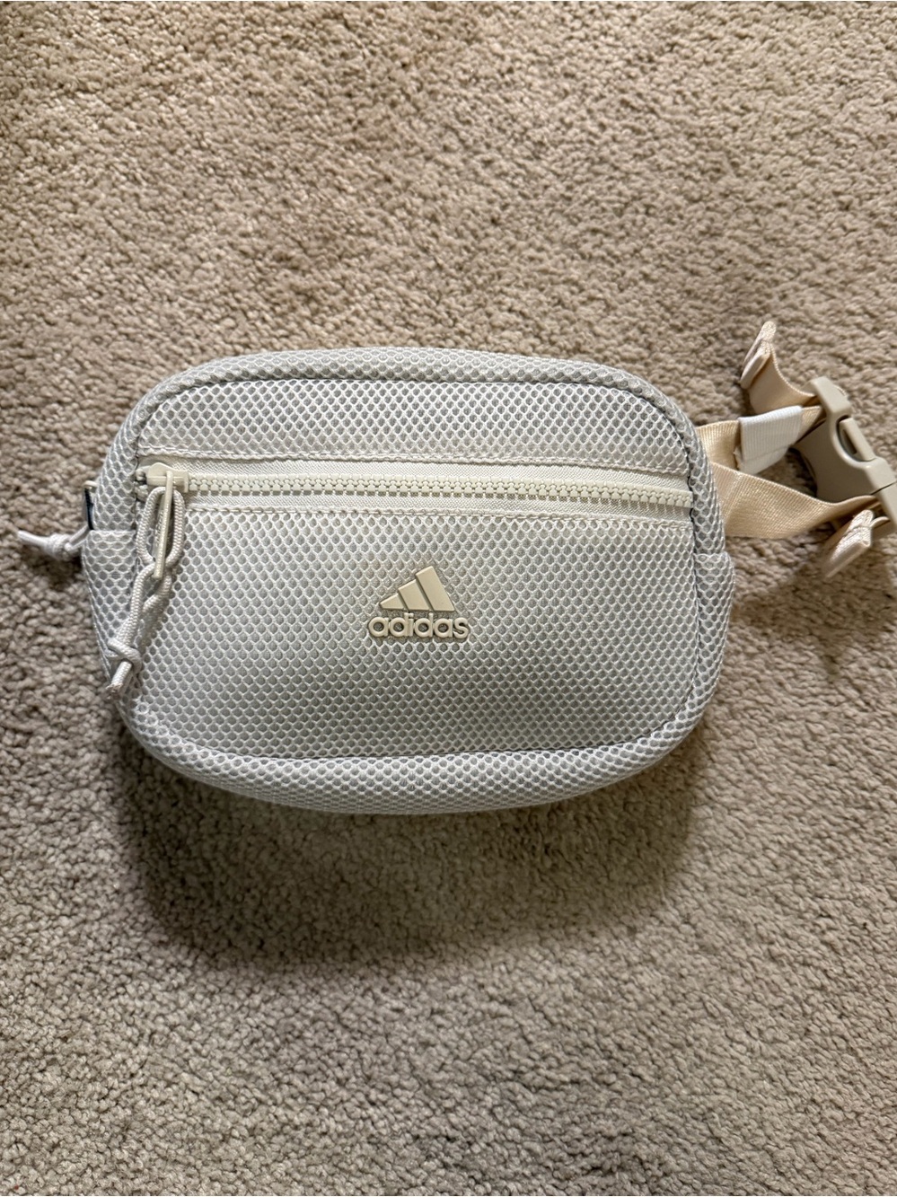 Adidas Airmesh Cream waist pack with a front zip pocket and an adjustable strap